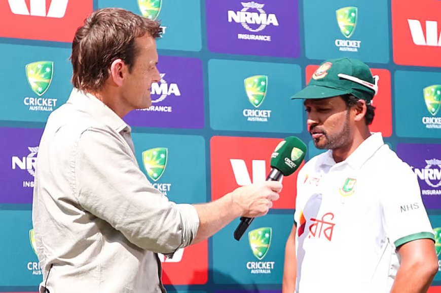 Najmul Hossain in front of Adam Gilchrist at the post-victory prize-giving ceremony.